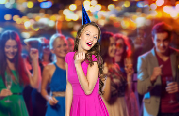 Sticker - happy woman or teen in party cap at night club