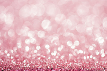 Pink defocused glitter background.