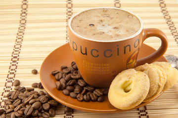 Wall Mural - cup of cappuccino and cookies