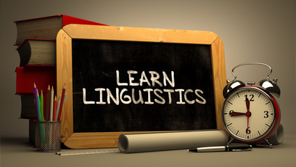 Hand Drawn Learn Linguistics Concept on Chalkboard.