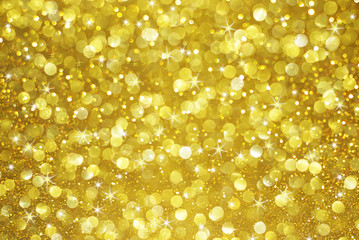 Wall Mural - gold glitter bokeh with stars abstract background
