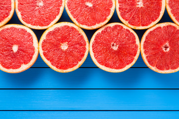 Wall Mural - Fresh grapefruits on wooden table