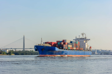 Blue tugboat sailing in calm seas