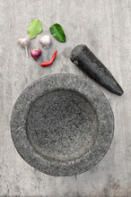 Stone Mortar With Many Kind Of Herbs In Kitchen
