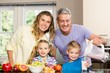 © WavebreakMediaMicro - Happy family preparing healthy smoothie
