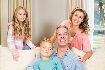 Wall Mural - Portrait of happy family on the sofa