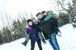 © Louis-Paul Photo - Happy parents and their kids in winterwear