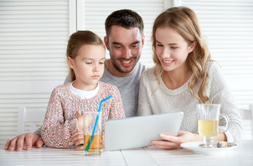 Sticker - happy family with tablet pc at restaurant