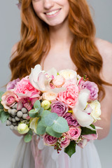 Canvas Print - Cropped image of a woman holding flowers