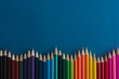 Colour pencils on blue background.