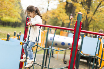 Wall Mural - Little girl at playground