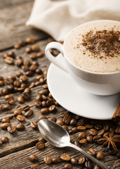 Wall Mural - Hot coffee and pastries on a wooden background