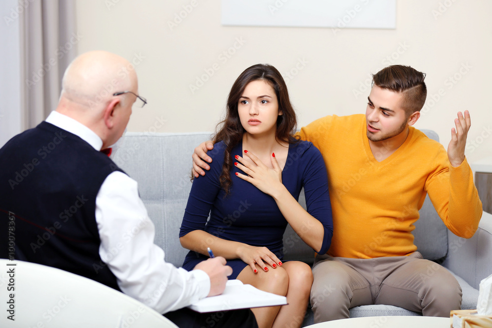 Young couple with problem on reception for family psychologist