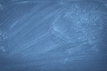 A blue colored old wall texture with visible decorative brush traces.