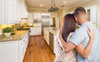 © Andy Dean - Young Hopeful Military Couple Looking At Custom Kitchen