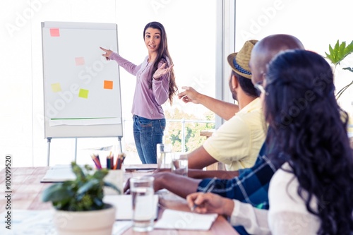 Fotografie, Obraz Businesswoman giving presentation to coworkers