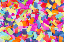 Brightly Colored Paper Confetti Background Featuring Red, Yellow, Blue, Green, Orange, And Bright Pink Carnival Colors