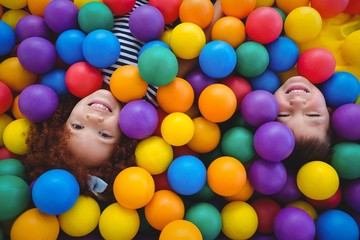 Cute smiling kids in sponge ball pool