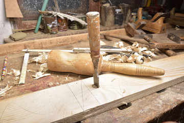 Wall Mural - carpenter working with plane on wooden