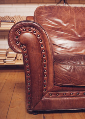 Wall Mural - Closeup texture of vintage brown leather armchair in  library