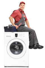 Poster - Repairman sitting on top of a washing machine