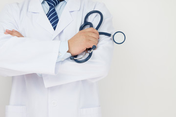 Doctors hand holding a stethoscope