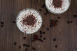Vanilla panna cotta with chocolate on a wooden background
