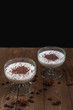 Vanilla panna cotta with chocolate on a wooden background