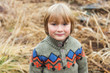 © annanahabed - Outdoor close up portrait of a cute little boy of 4-5 years old, playing by the lake on a cold day