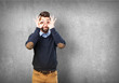 © asierromero - man doing a glasses sign