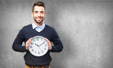 man holding a clock