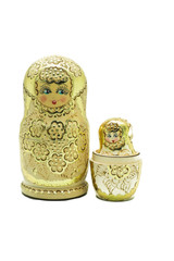 A gold matryoshka doll (Russian Doll) isolated on white