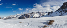 Mountains Under The Snow In Winter. Panorama Of Snow Mountain Range Landscape With Blue Sky.