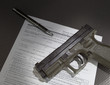 Handgun and the paperwork to get a background check before taking ownership