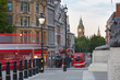 Big Ben with red London bus seen from Trafalgar square, morning