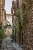 Fototapeta Panele - Narrow streets of the medieval village of Spello in Umbria (Italy)