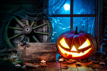 Wall Mural - Halloween pumpkin head jack lantern with burning candles