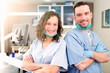 © Production Perig - Portrait of a team of young attractive dentist in his office