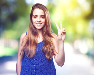 Wall Mural - young pretty woman doing number two gesture