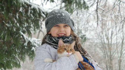 Canvas Print - child and cat on snow