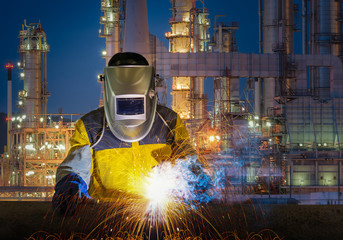 Industrial Worker at the factory welding closeup