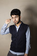 © bilalizaddin - Iraqi brunette boy in strange pose inside studio
