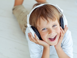 Wall Mural - A boy are listening a music 