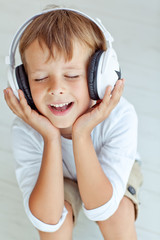 Wall Mural - A boy are listening a music 