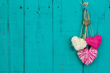 Pink And White Hearts And Key Hanging On Teal Blue Wood Door