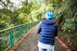 © twinsterphoto - Young man cycling in the forest trail in cold weather during weekend