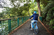 © twinsterphoto - Young man cycling in the forest trail in cold weather during weekend