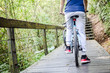© twinsterphoto - Young man cycling in the forest trail in cold weather during weekend