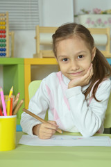 Wall Mural - little girl drawing at home
