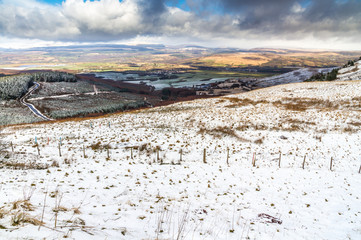 Light snow over fields, hills and trees.  Vale of Neath, South W